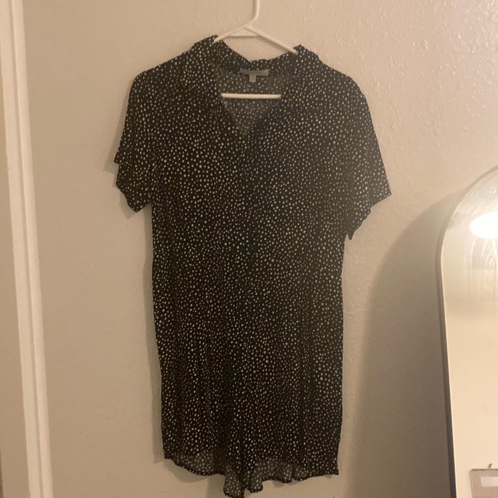 Black and white polka dot short romper.